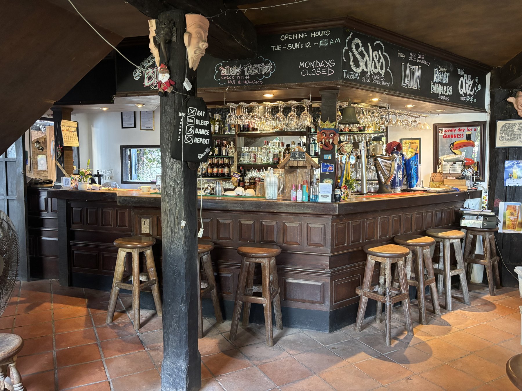 The bar at The Green Man with chalkboard schedule